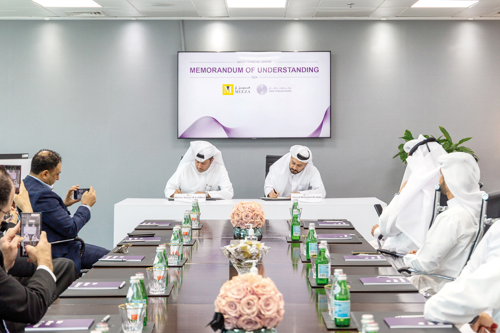 QFC CEO Yousuf Mohamed Al Jaida and MEEZA Acting CEO Mohsin Nasser Al Marri, Acting Chief Executive Officer with other officials during the MoU signing.